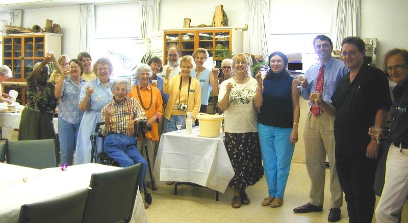 Drs. Maunder and Pipoli lead Lynka and the Volunteers in a toast